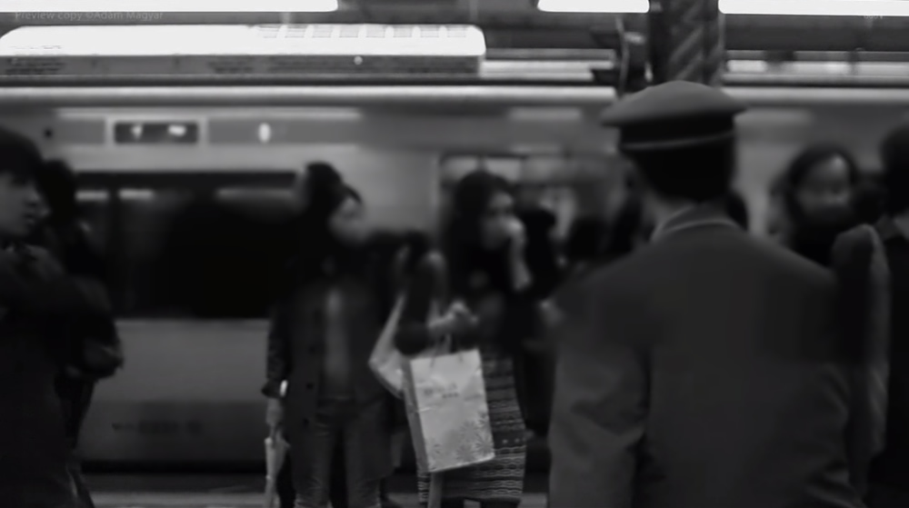 Awesome Footage Shot with High-Speed Camera features People Standing in Platform of Shinjuku Station.