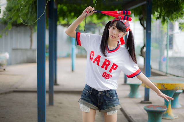 What is Carp-girls? -women wearing red costume in baseball stadium-